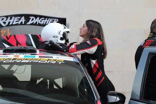 Rhea preparing beside her rally car