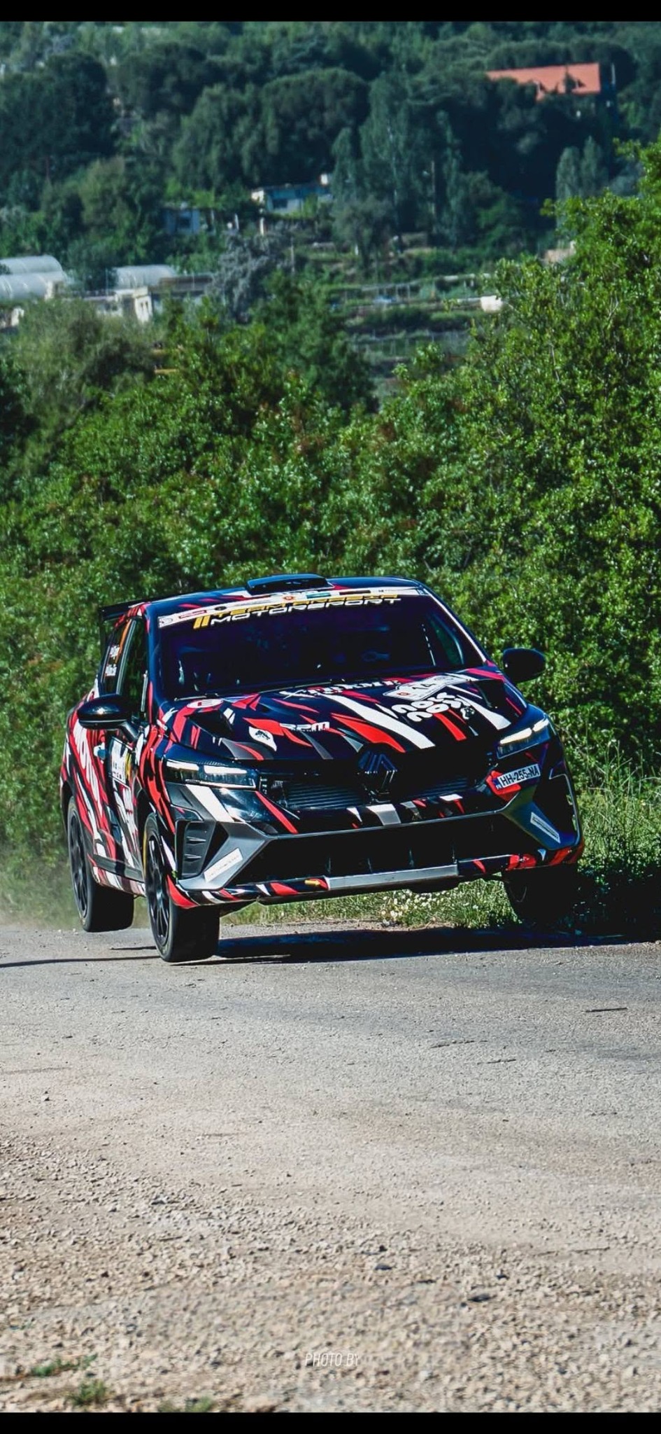 Rhea's rally car on a fast road stage