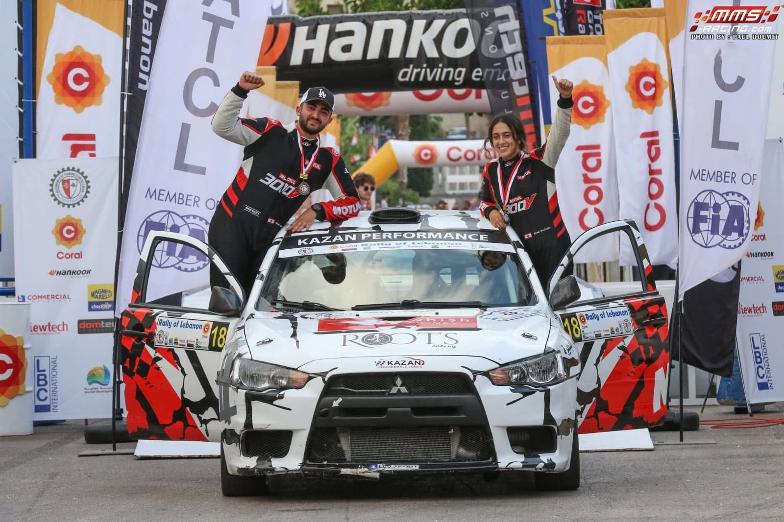 Rhea Dagher and her co-driver celebrating on their rally car